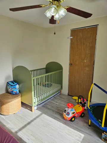 a bedroom with furniture and a window