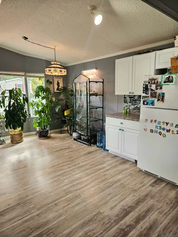 a kitchen with a sink and a stove top oven