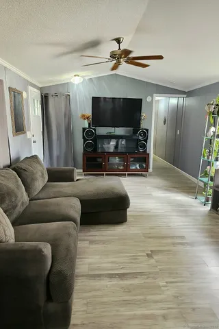 a bedroom with a bed and a mirror