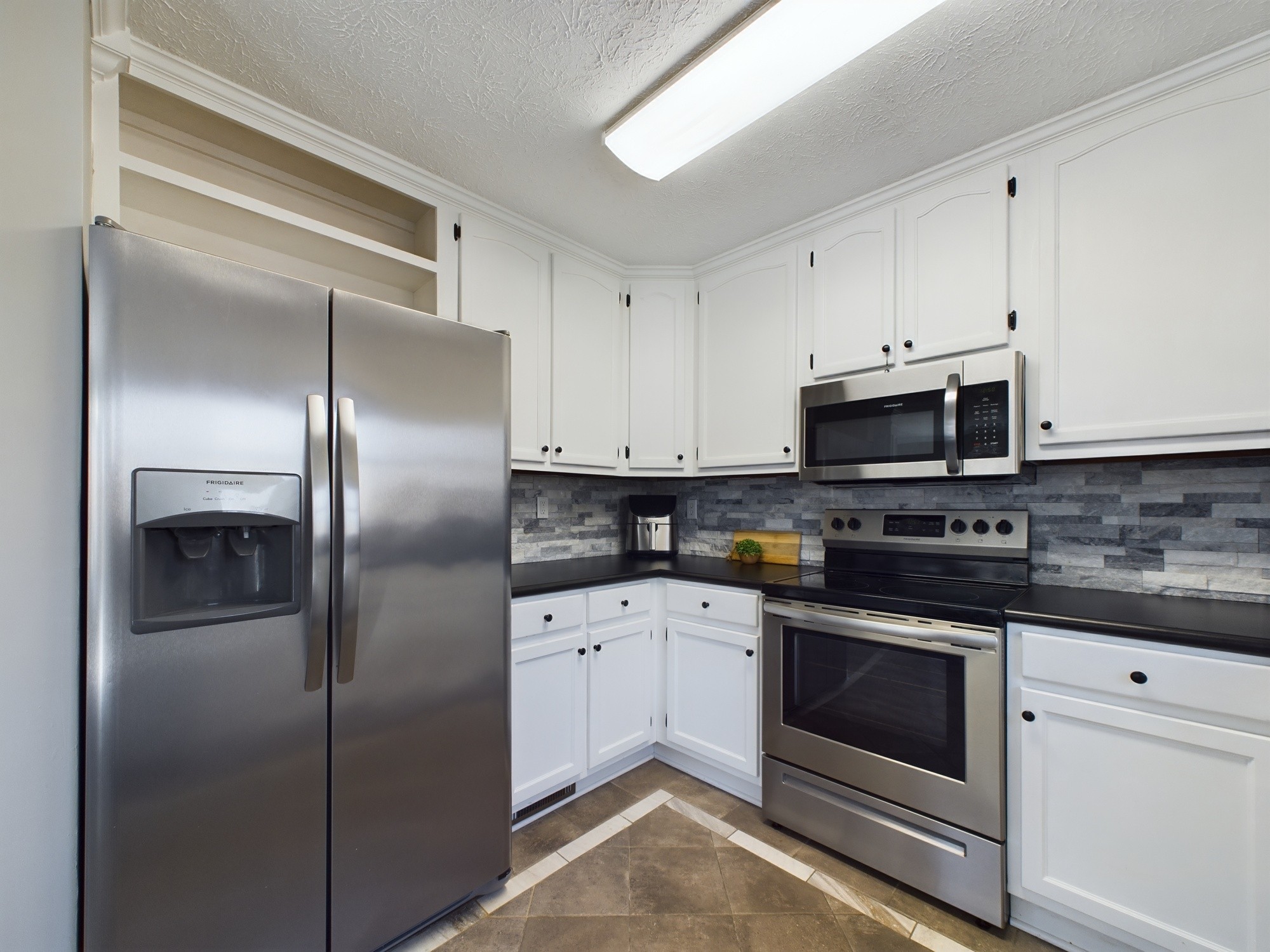 17 Alice Boynton Road Manchester, TN 37355 - Photo 11 of 31 a kitchen with cabinets stainless steel appliances and sink