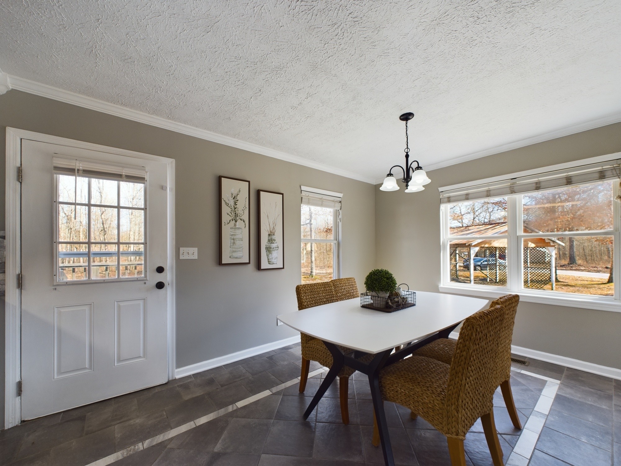 17 Alice Boynton Road Manchester, TN 37355 - Photo 6 of 31 a dining room with wooden floor a chandelier a wooden table and chairs