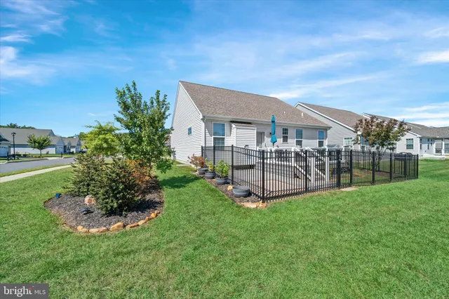 a view of a house with backyard porch and sitting area