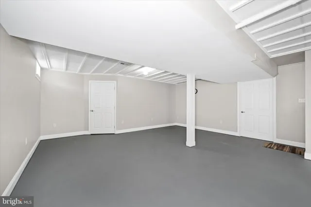 a view of empty room with a flat screen tv