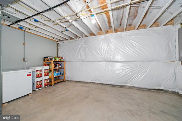 a view of a deck with furniture and a barbeque
