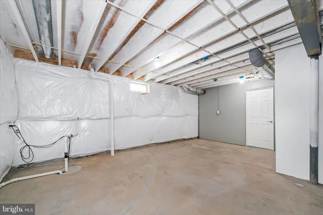 a view of storage and utility room with stairs
