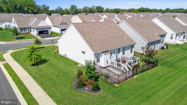 an aerial view of a house with a garden and plants