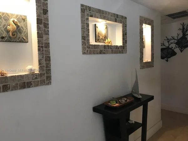 a bathroom with a sink mirror and vanity