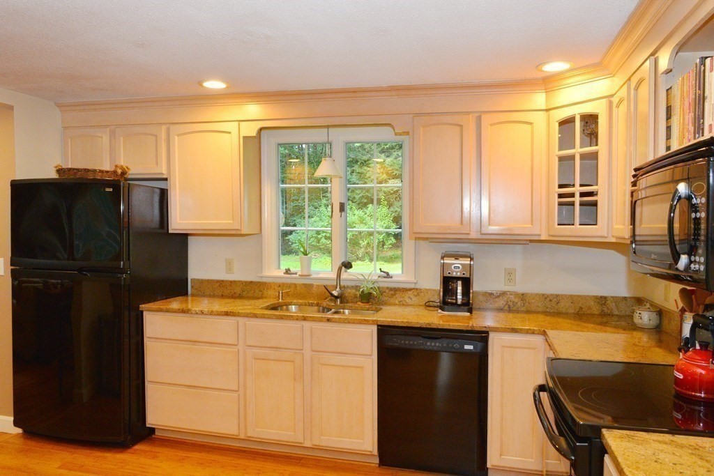 7 Ledgewood Circle Topsfield, MA 01983 - Photo 11 of 36 a kitchen with stainless steel appliances granite countertop a refrigerator and a sink