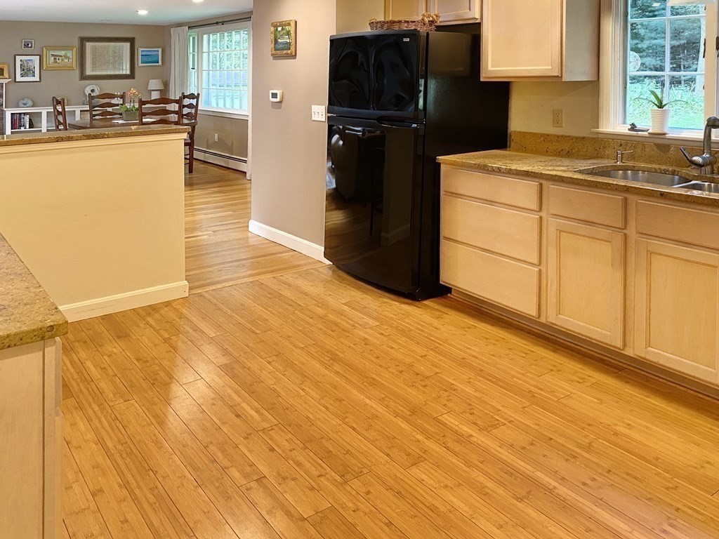 7 Ledgewood Circle Topsfield, MA 01983 - Photo 13 of 36 a kitchen with granite countertop a refrigerator and a stove top oven