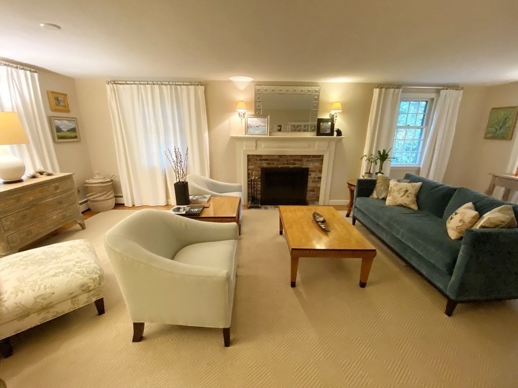 7 Ledgewood Circle Topsfield, MA 01983 - Photo 17 of 36 a living room with furniture and a fireplace