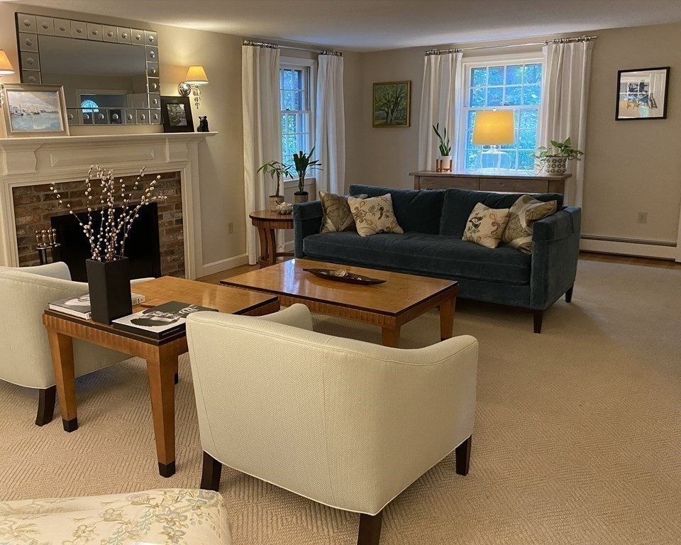 7 Ledgewood Circle Topsfield, MA 01983 - Photo 19 of 36 a living room with furniture and a fireplace