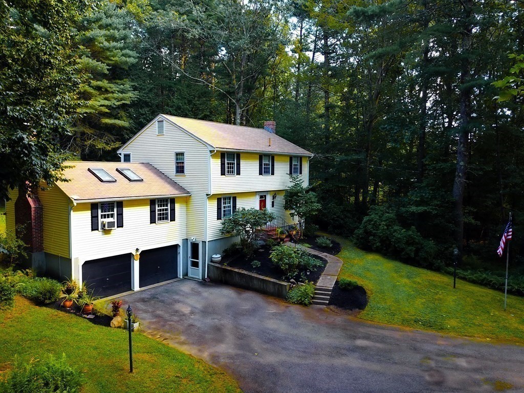 7 Ledgewood Circle Topsfield, MA 01983 - Photo 2 of 36 a front view of a house with a yard