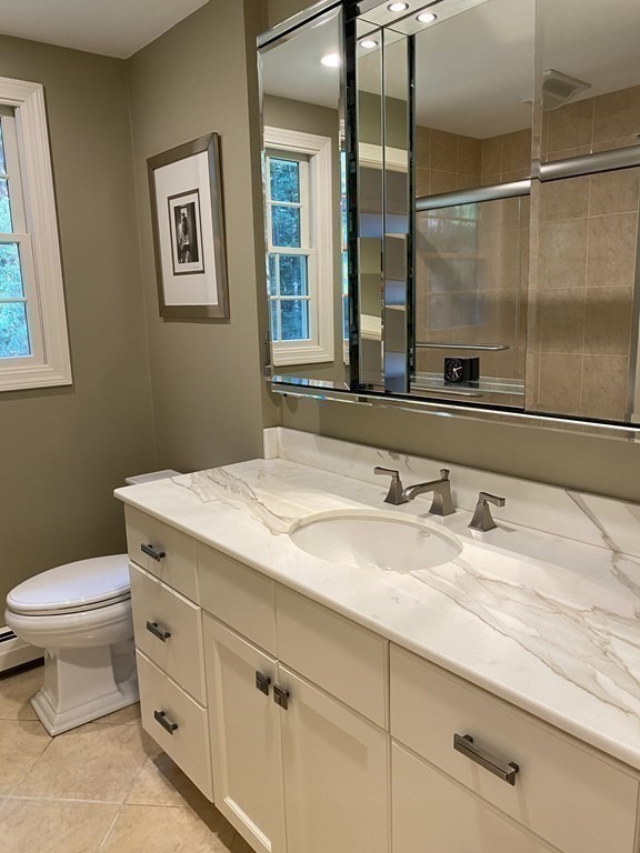 7 Ledgewood Circle Topsfield, MA 01983 - Photo 21 of 36 a bathroom with a granite countertop sink a toilet and a mirror