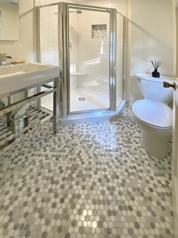 7 Ledgewood Circle Topsfield, MA 01983 - Photo 24 of 36 a bathroom with a sink toilet and shower