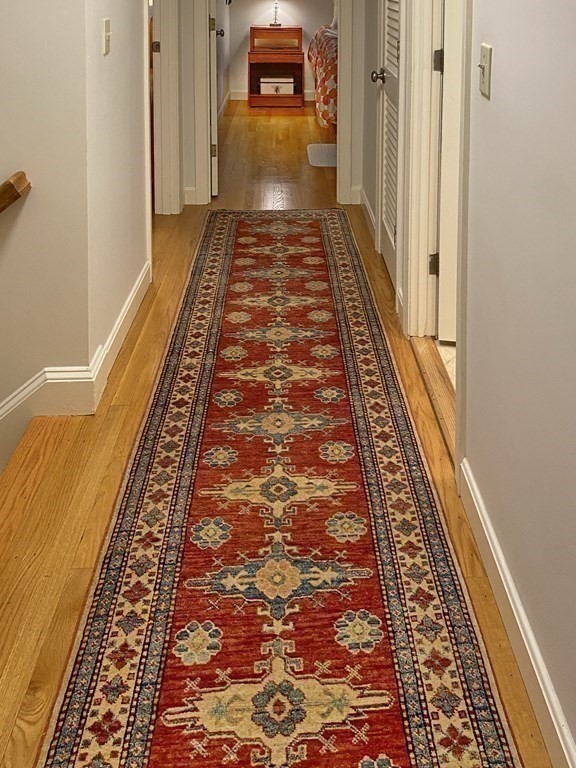 7 Ledgewood Circle Topsfield, MA 01983 - Photo 25 of 36 a view of a hallway with wooden floor