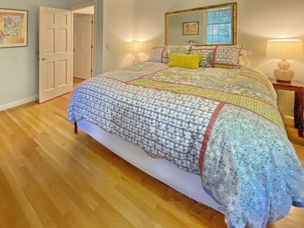 7 Ledgewood Circle Topsfield, MA 01983 - Photo 27 of 36 a bedroom with a bed and wooden floor