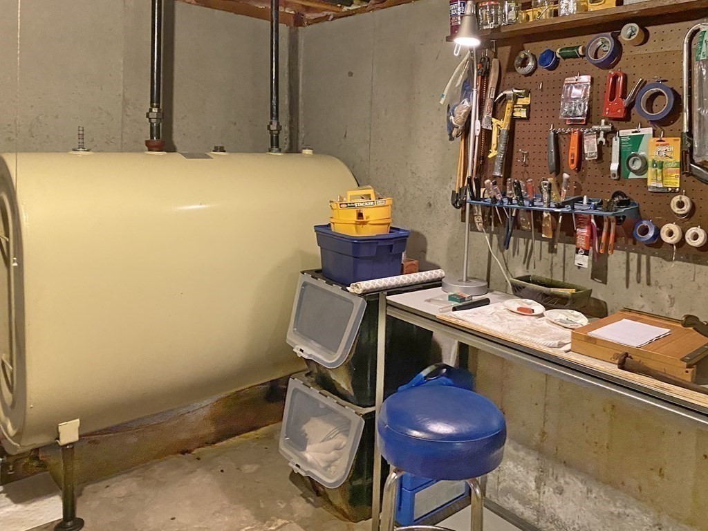 7 Ledgewood Circle Topsfield, MA 01983 - Photo 30 of 36 a room with a chair and potted plant