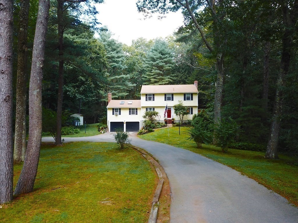 7 Ledgewood Circle Topsfield, MA 01983 - Photo 35 of 36 a view of a house with a yard patio and a small yard