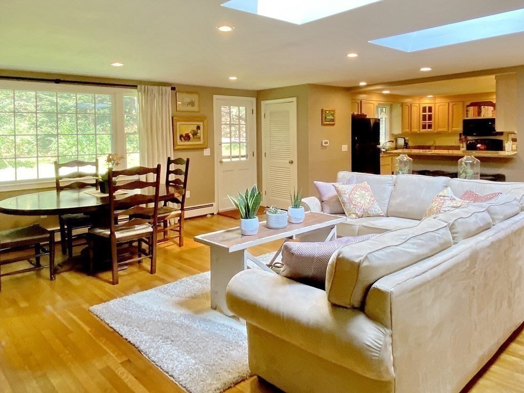 7 Ledgewood Circle Topsfield, MA 01983 - Photo 9 of 36 a living room with furniture kitchen view and large windows