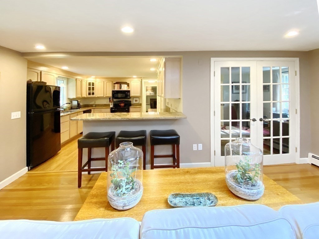 7 Ledgewood Circle Topsfield, MA 01983 - Photo 10 of 36 a dining hall with granite countertop a dining table and chairs