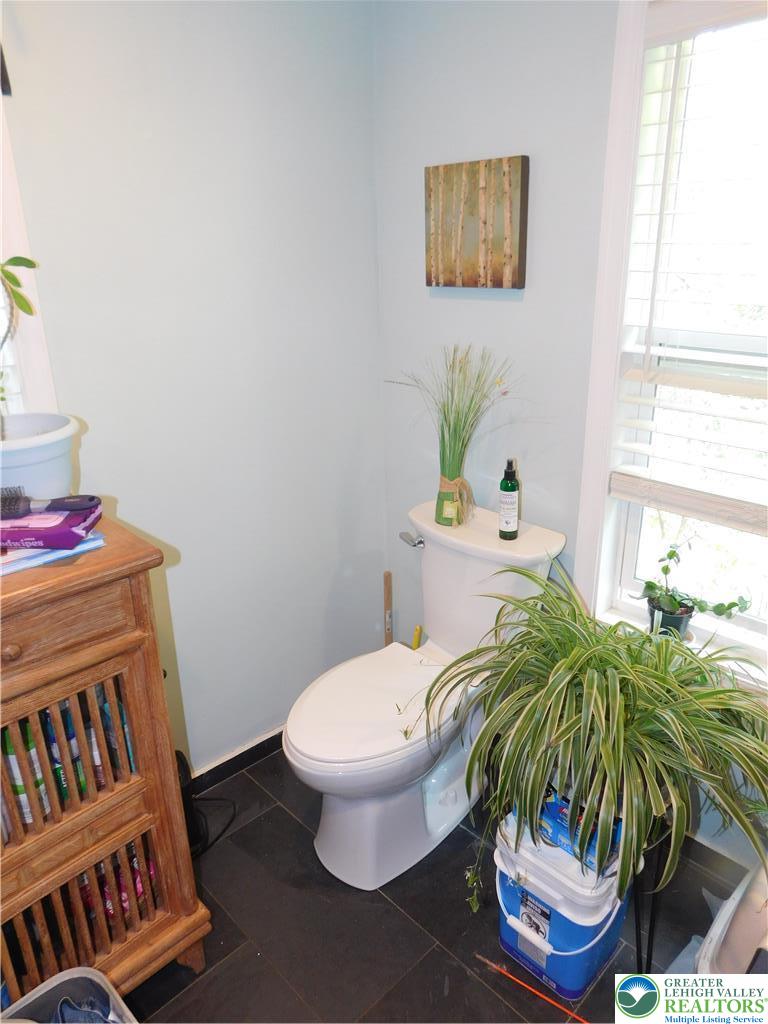 41 Reeder Street Mount Pocono, PA 18344 - Photo 34 of 41 Functional bathroom with tiled flooring and a convenient window for natural light.
