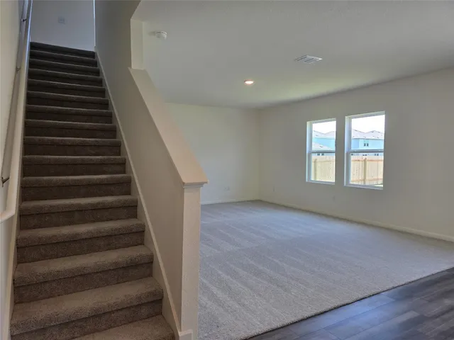 an entryway in a hall with a window