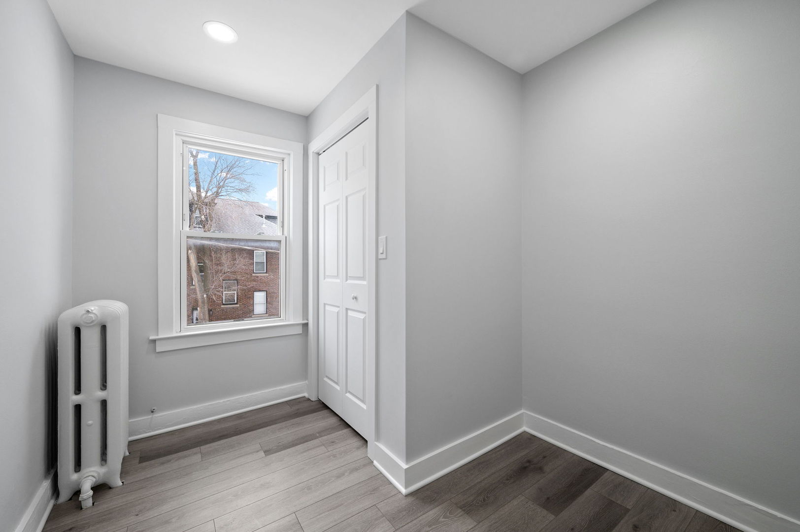 423 Funston Avenue, Unit 2F Highwood, IL 60040 - Photo 12 of 13 an empty room with windows and closet