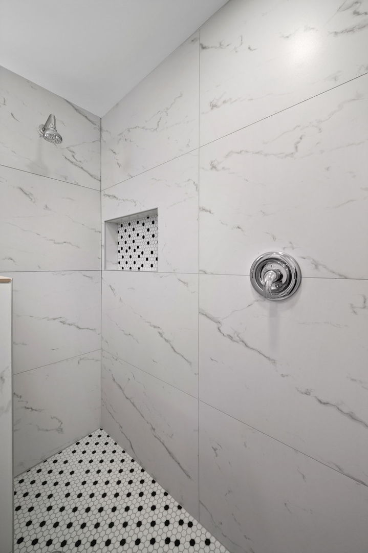 423 Funston Avenue, Unit 2F Highwood, IL 60040 - Photo 9 of 13 a bathroom with a shower