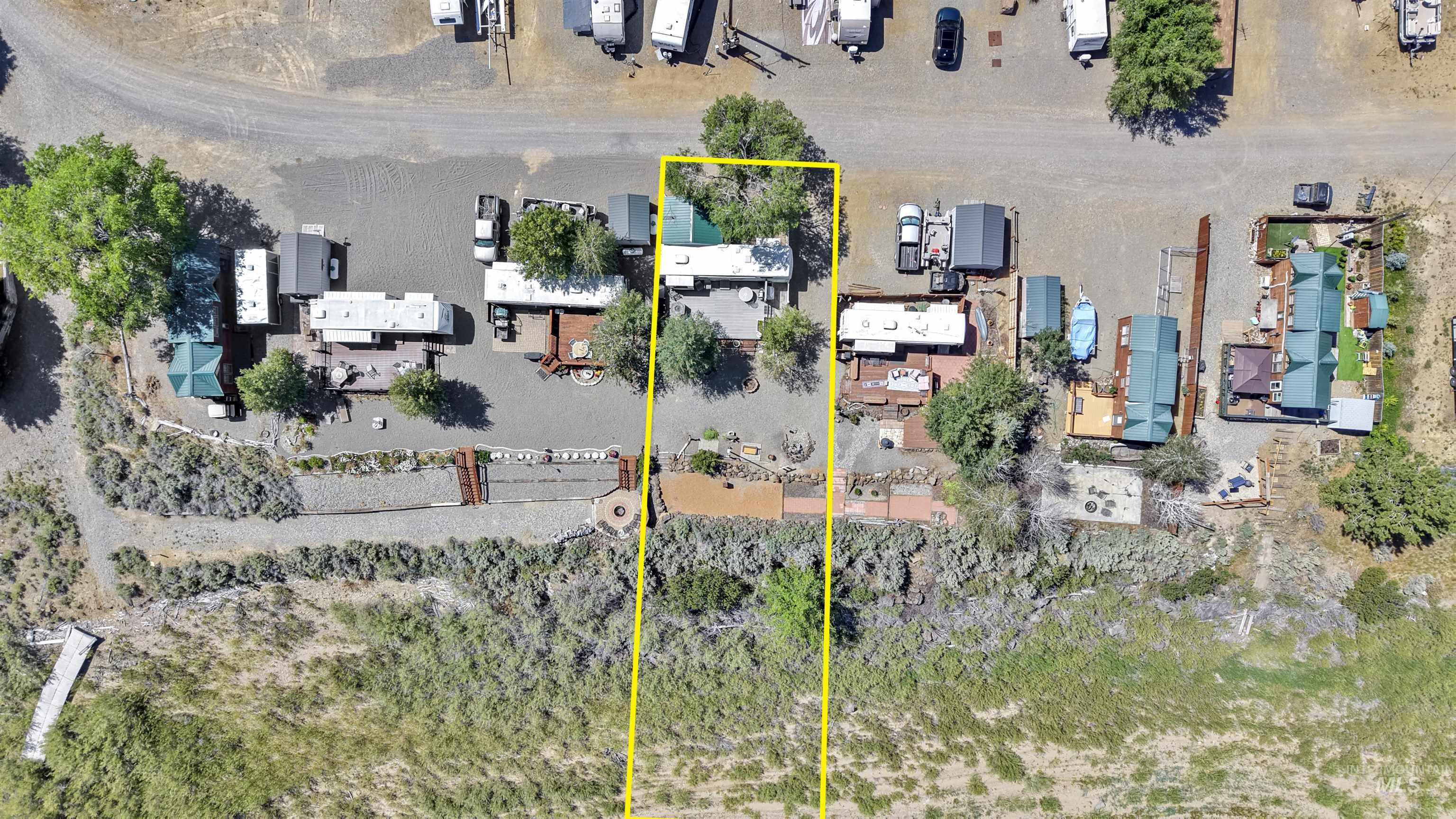 106 West Magic Road Shoshone, ID 83352 - Photo 44 of 45 Gravel lot with mature trees, established landscaping, and a designated outdoor living area