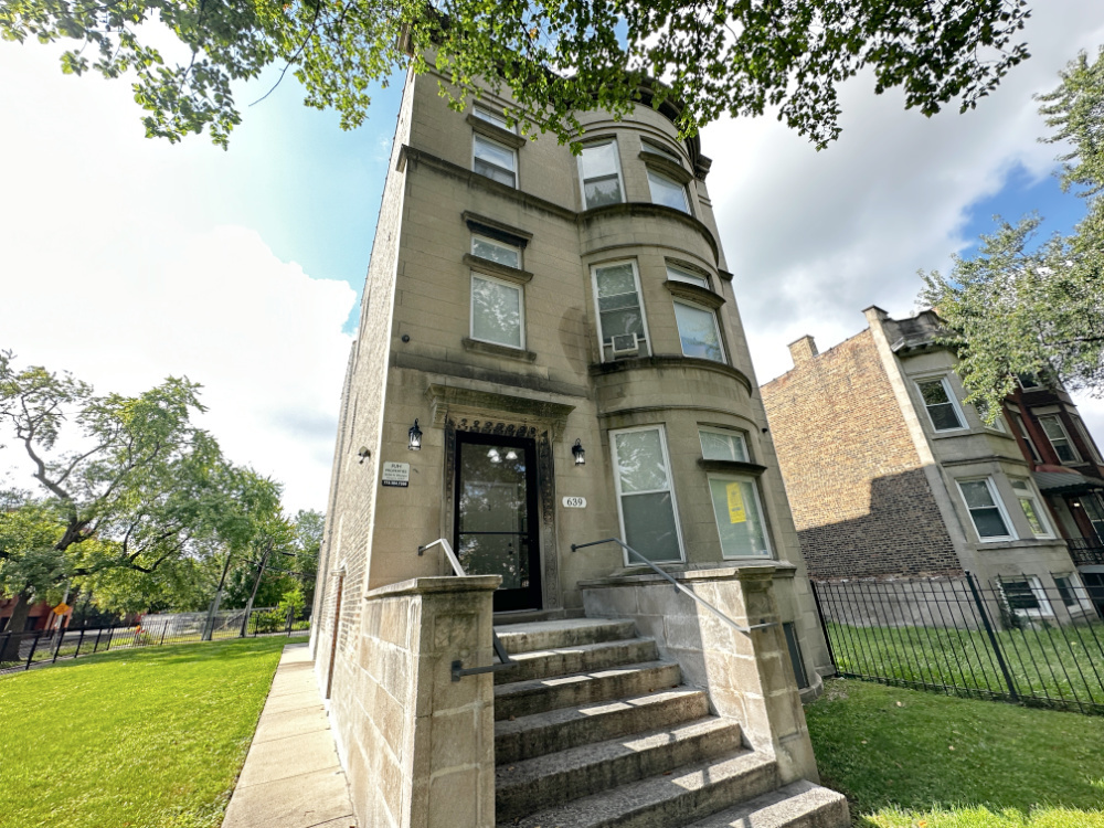 639 West Garfield Boulevard, Unit 3 Chicago, IL 60621 - Photo 1 of 13 a front view of a residential houses with yard