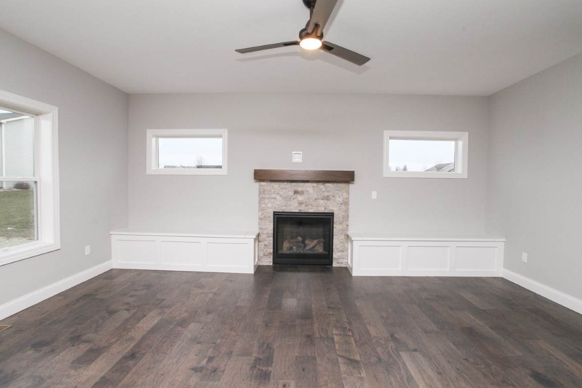 2702 Lone Oak Road Bloomington, IL 61705 - Photo 13 of 19 wooden floor fireplace and windows in an empty room