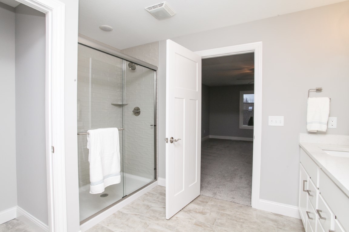 2702 Lone Oak Road Bloomington, IL 61705 - Photo 15 of 19 a view of a bathroom with a shower and a sink