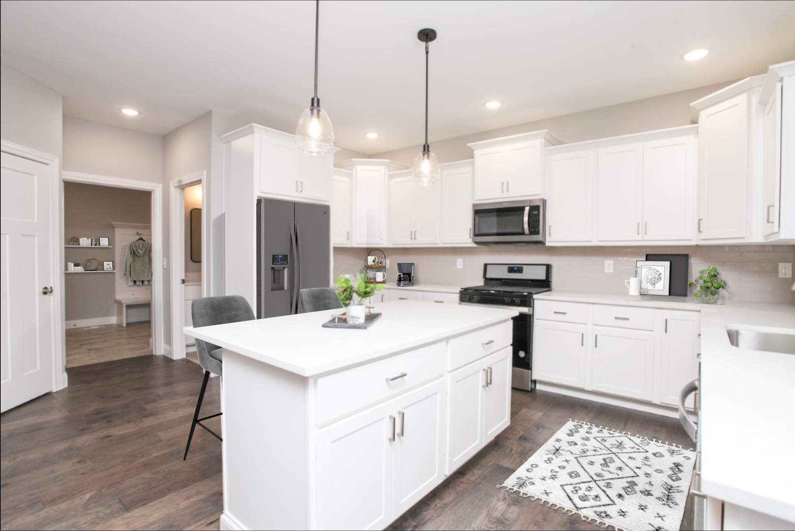2702 Lone Oak Road Bloomington, IL 61705 - Photo 4 of 19 a kitchen with a sink a counter top space stainless steel appliances and cabinets