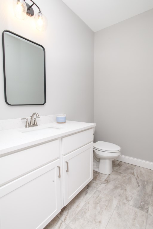 2702 Lone Oak Road Bloomington, IL 61705 - Photo 10 of 19 a bathroom with a toilet sink and mirror
