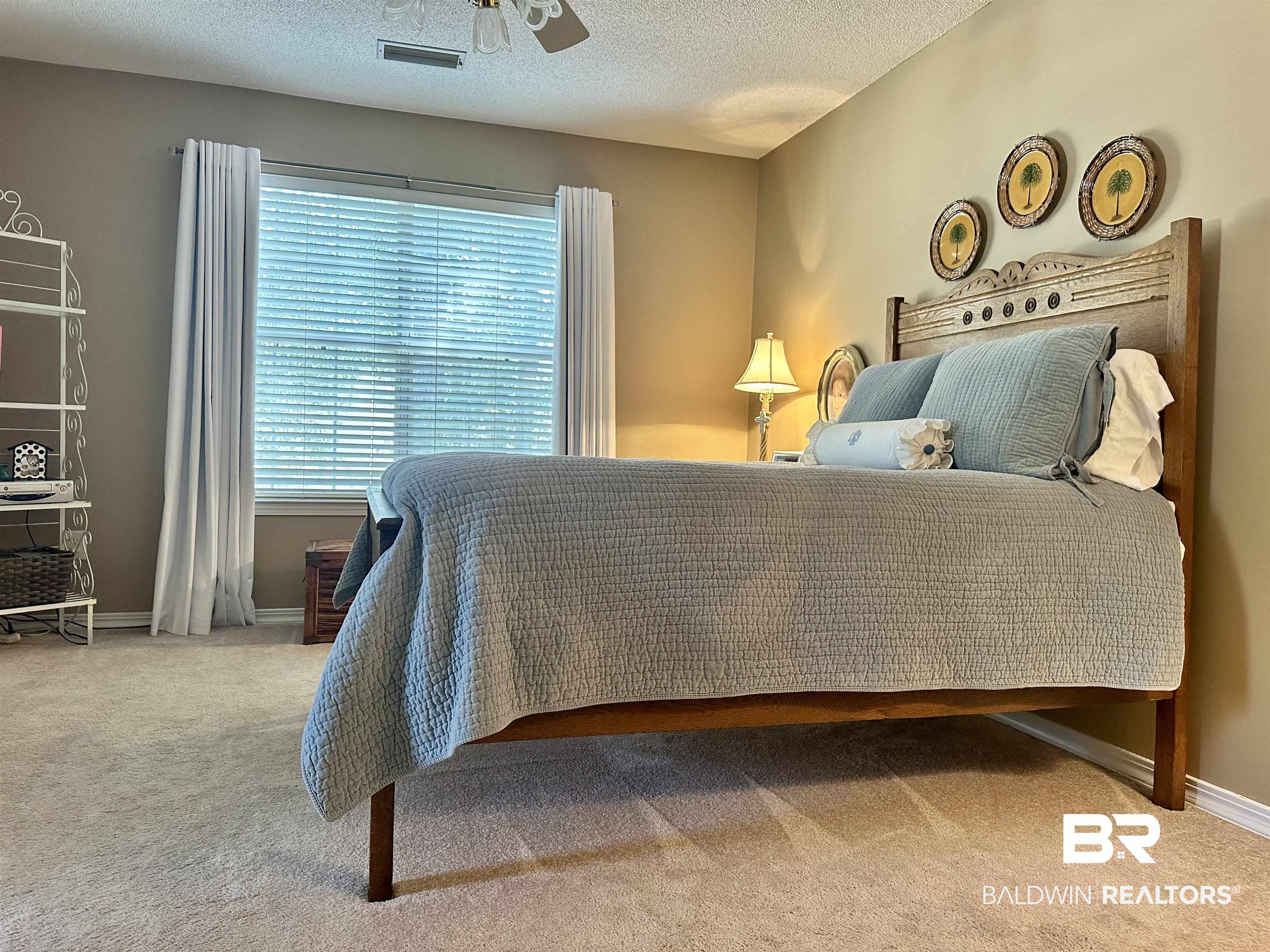 148 Brooks Boulevard Brewton, AL 36426 - Photo 23 of 45 Carpeted bedroom featuring ceiling fan, baseboards, visible vents, and a textured ceiling
