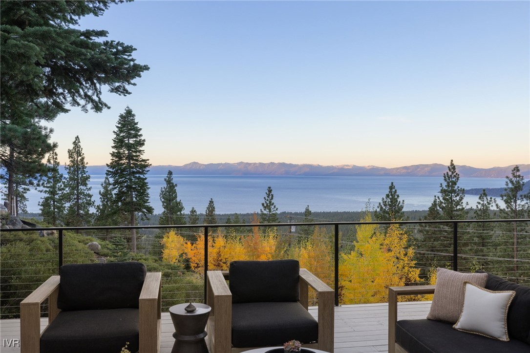 a view of a patio with couches and city view