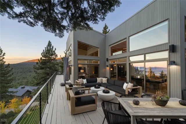 a living room with patio furniture and a fireplace