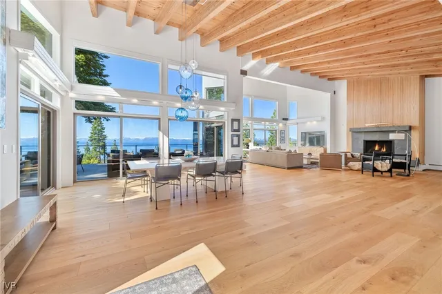 a living room with furniture wooden floor and a fireplace