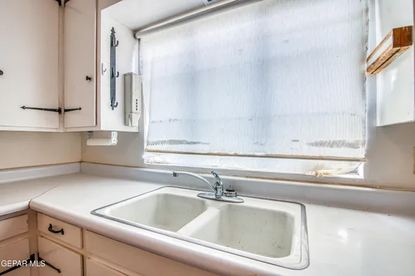a view of bathroom with shower and mirror