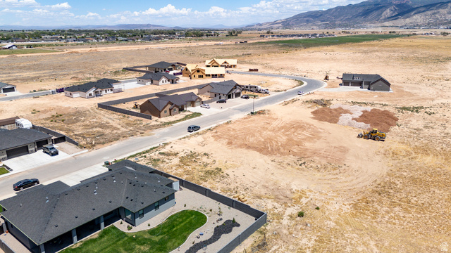 3793 925 North, Unit 13 Cedar City, UT 84721 - Photo 9 of 13 Newly constructed homes in a developing subdivision, featuring paved roads, uniform roofing, and varied home designs