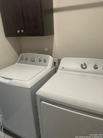 an empty room with a empty space and windows