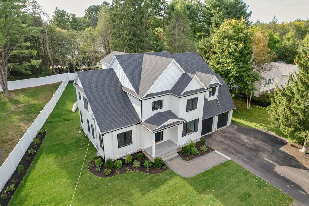 526 Marrett Road Lexington, MA 02421 - Photo 1 of 37 a aerial view of a house with a big yard potted plants and large tree