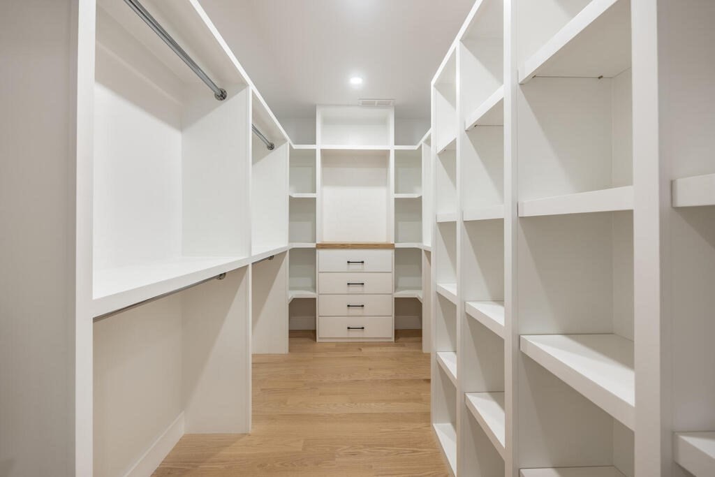 526 Marrett Road Lexington, MA 02421 - Photo 26 of 37 a view of walk in closet with empty racks