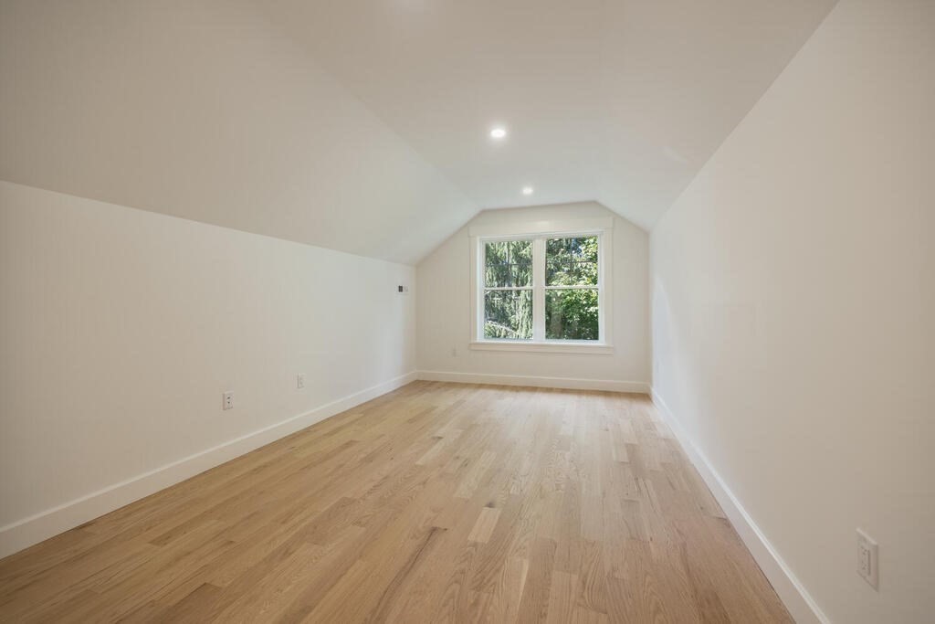 526 Marrett Road Lexington, MA 02421 - Photo 29 of 37 an empty room with wooden floor and windows