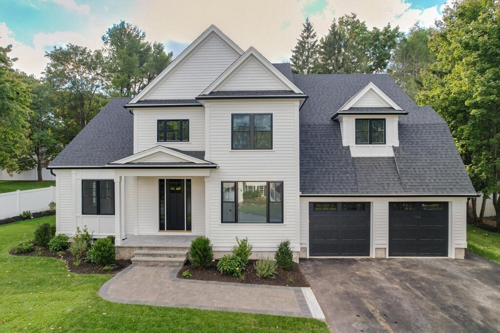 526 Marrett Road Lexington, MA 02421 - Photo 3 of 37 a front view of a house with yard and green space