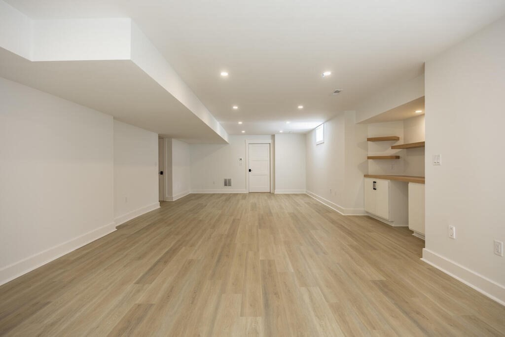526 Marrett Road Lexington, MA 02421 - Photo 33 of 37 a view of empty room with wooden floor