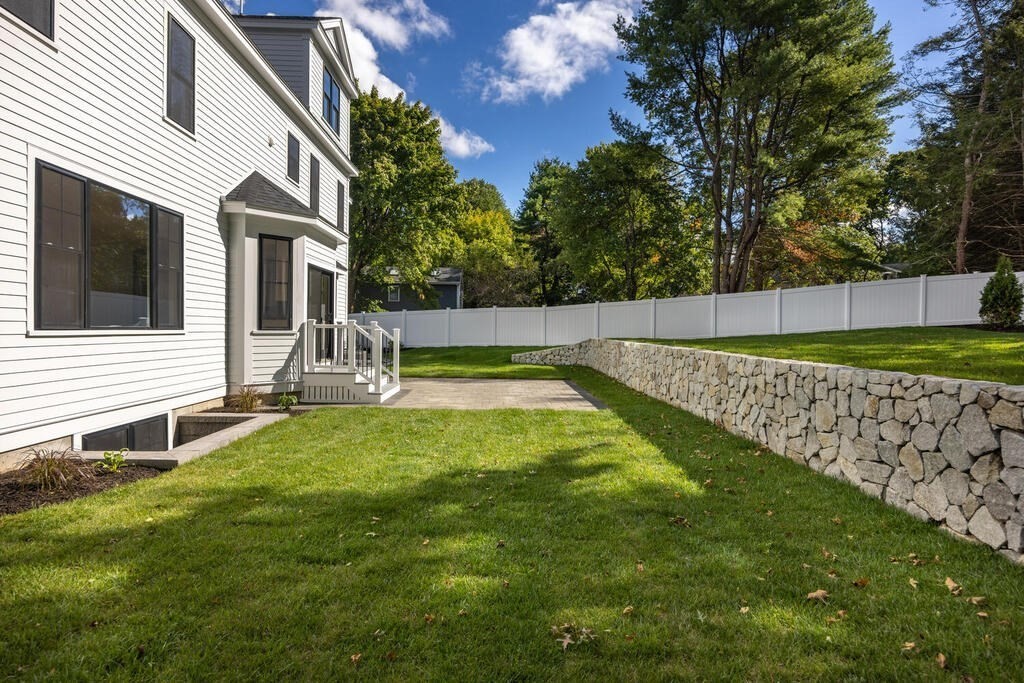 526 Marrett Road Lexington, MA 02421 - Photo 36 of 37 a view of a house with swimming pool and a yard