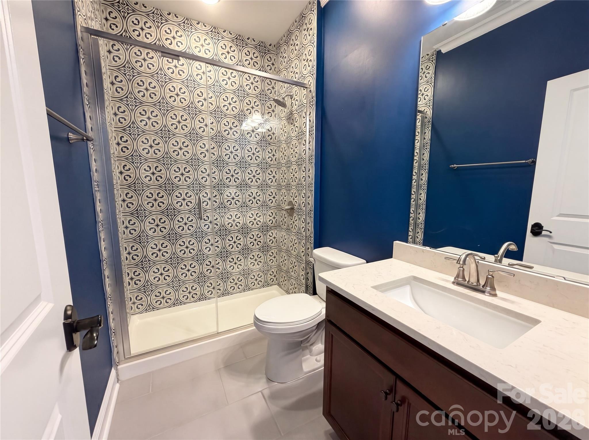 1321 Fishing Creek Road Clover, SC 29710 - Photo 12 of 19 a bathroom with a sink a toilet a mirror and shower