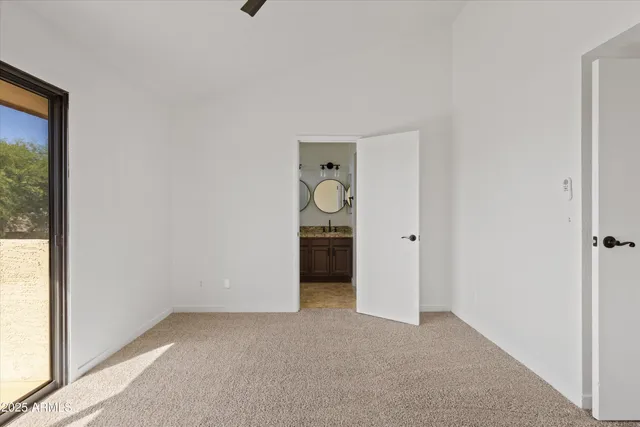 a big room with closet and a window