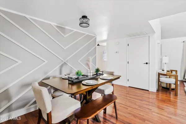 a dining room with furniture and window